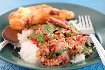 Spicy fried beef with basil leaves on dish, Food in Thailand