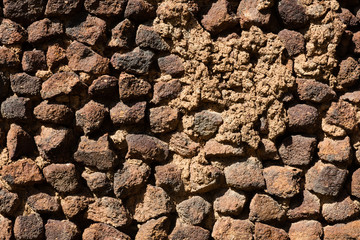 wall of brick, tuff and stone.