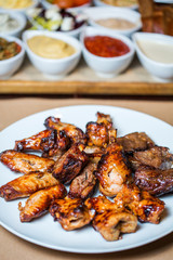 grilled meat dish on the background of sauces