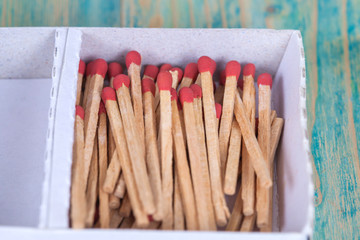 Matchsticks over wooden background
