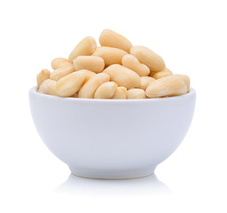peanuts in a wood bowl on white background