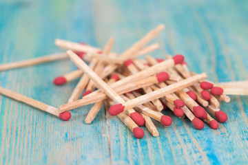 Matchsticks over wooden background