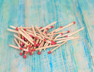Matchsticks over wooden background
