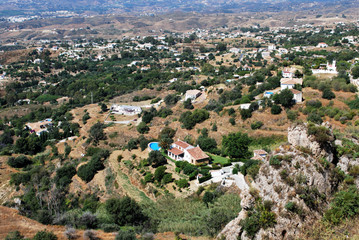 Fototapeta na wymiar Elevated view of villas with swimming pools and surrounding mountain landscape near Mijas.