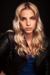 portrait of a beautiful blonde woman in leaher jacket