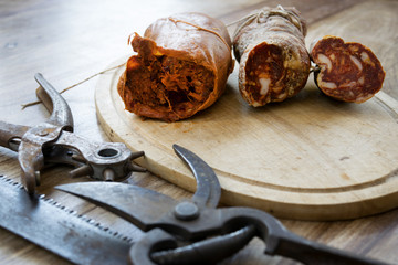 nduja and soppressata salami with old working tools