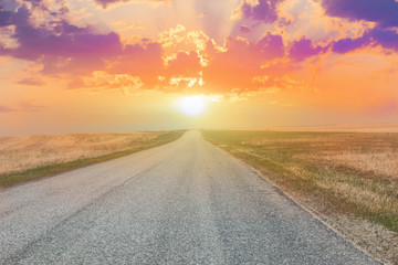 sunset over the country highway