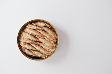 Top view of tin can sprats on white background