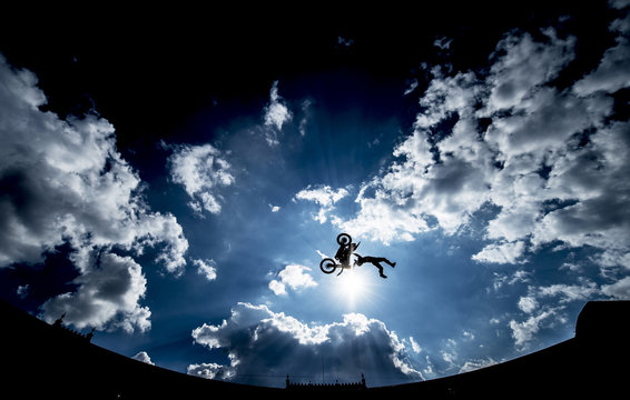 Motorcyclist performing a high jump