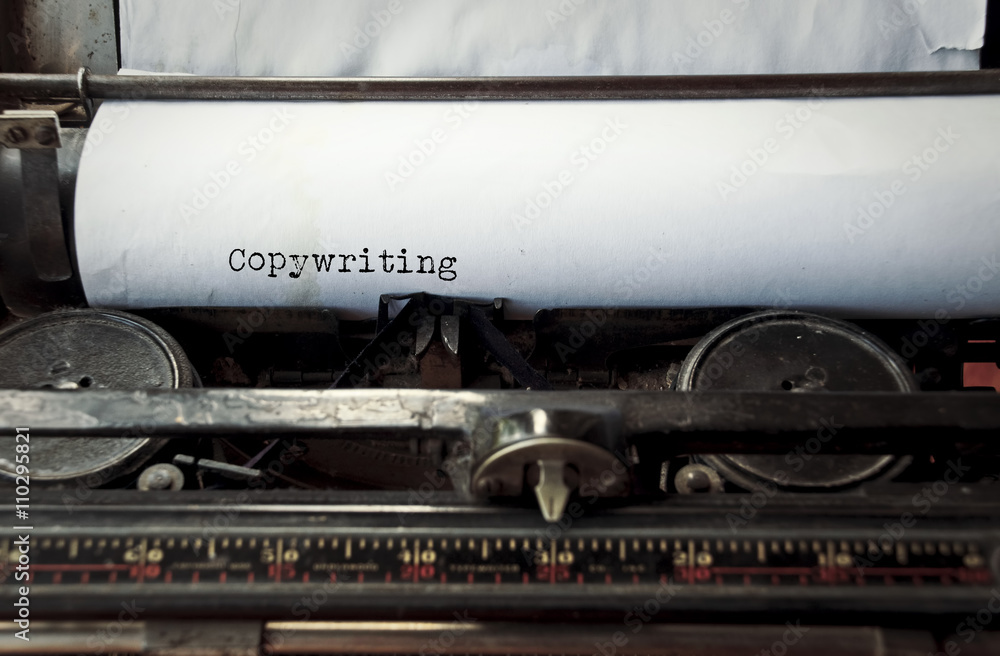 Aufkleber close up image of typewriter with paper sheet and the phrase: copywriting. copy space for your text.