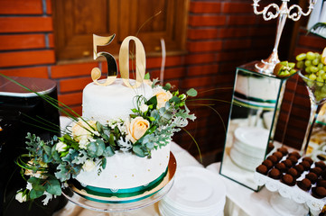 Cake anniversary in 50 at table