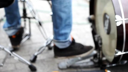 street musician plays the drums   /  street musician plays the drums, the blurred background, the concept of lifestyle