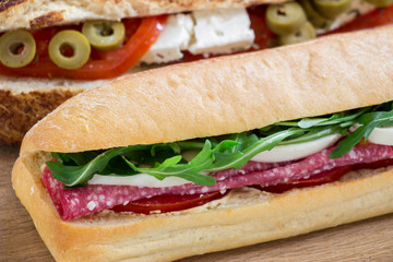 Diagonally one sandwich behind the other. 2 different sandwiches.