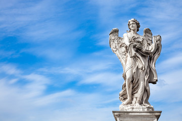 Fototapeta na wymiar Angel statue by Bernini along Sant'Angelo bridge in Rome