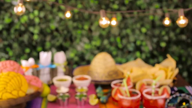 Party table with tamales, strawberry margaritas and pan dulche bread