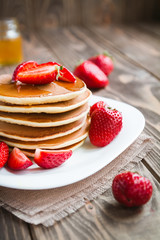 pancakes with fresh srtawberry on a table