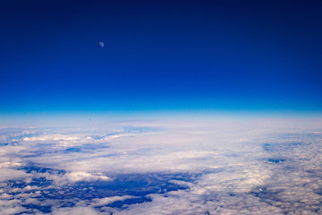 Naklejka na ściany i meble Amazing Aerial View of Clouds and Moon - Panoramic Birds Eye View of White Clouds and Blue Sky