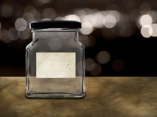 Empty jar with blank label. savings, or school fees maybe.