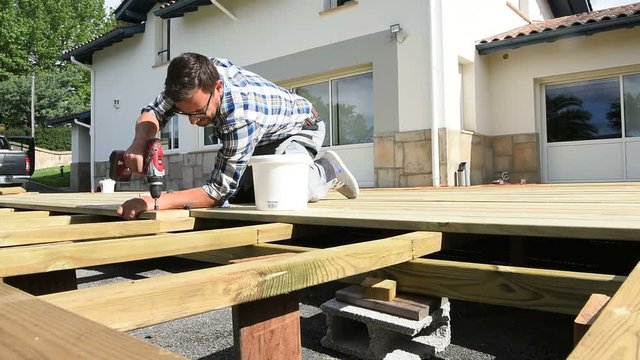 Carpenter building wooden deck