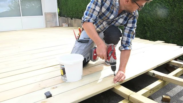 Carpenter building wooden deck