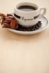 fresh coffee drink and beans with cookie