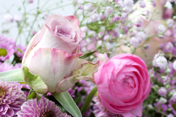 Pastel rose in a bouquet of flowers