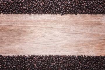 Coffee beans on wooden background, Composition with free space o