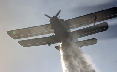 Fire-fighting aircraft drops water 