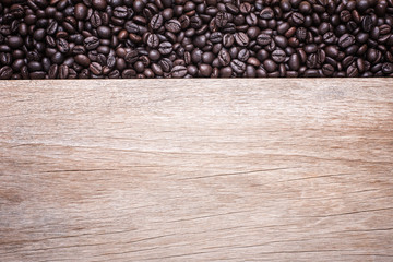 Coffee beans on wooden background, Composition with free space o