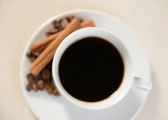 Obraz premium Cup of coffee with cinnamon