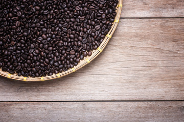 Coffee beans on wooden background, Composition with free space o