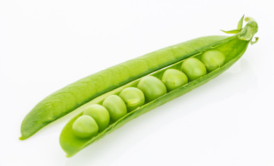 Fresh green pea pod closeup, isolated on white background