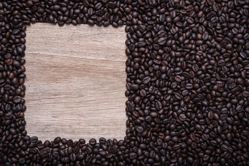 Coffee beans on wooden background, Composition with free space o