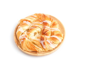 Close up Danish pastries on wooden dish isolated on white