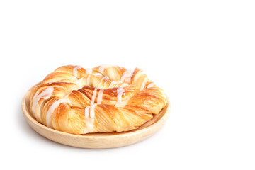 Close up Danish pastries on wooden dish isolated on white