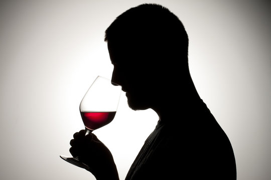 Man Drinking A Red  Wine