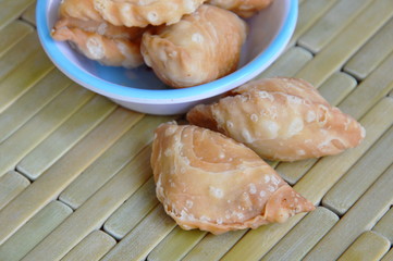 little chicken filled curry puff on the cup