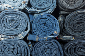 jeans twisted in rolls isolated on white
