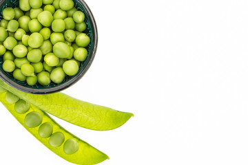 Fresh green peas in bowl, on white background with copy-space