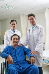 Doctor, nurse and happy mature patient: successful recovery