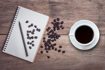 White coffee cup on wooden table top view