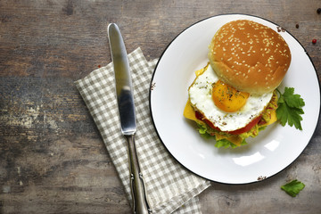 Vegetarian burger with guacamole and roasted egg.Top view.