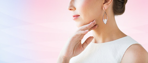 close up of beautiful woman face with earring