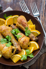 Fried chicken legs with orange