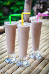 Chocolate milkshakes on bamboo table