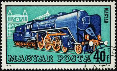 Fototapeta na wymiar Old locomotive on postage stamp