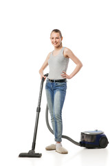 Fototapeta na wymiar Smiling woman with vacuum-cleaner isolated