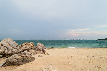 Fototapeta na wymiar Beach with city view when the rain is coming