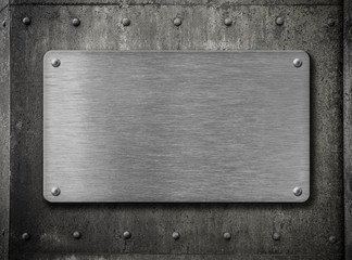 metal plate over grunge rusty background