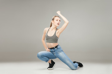 Young blonde woman posing in studio